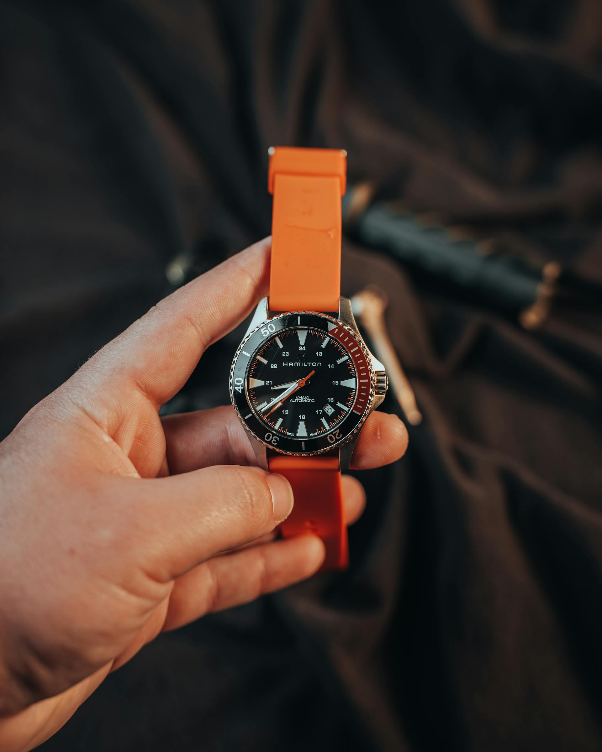 Close-up of a Wristwatch with an Orange Strap